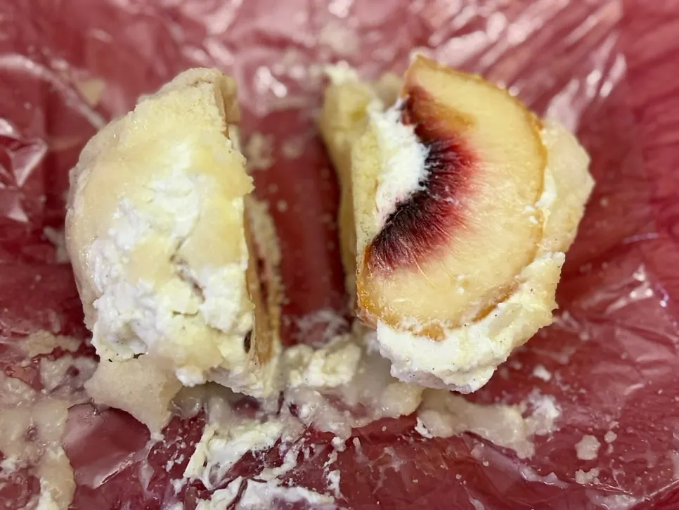 Close-up of mochi showing the moist gold kiwi inside