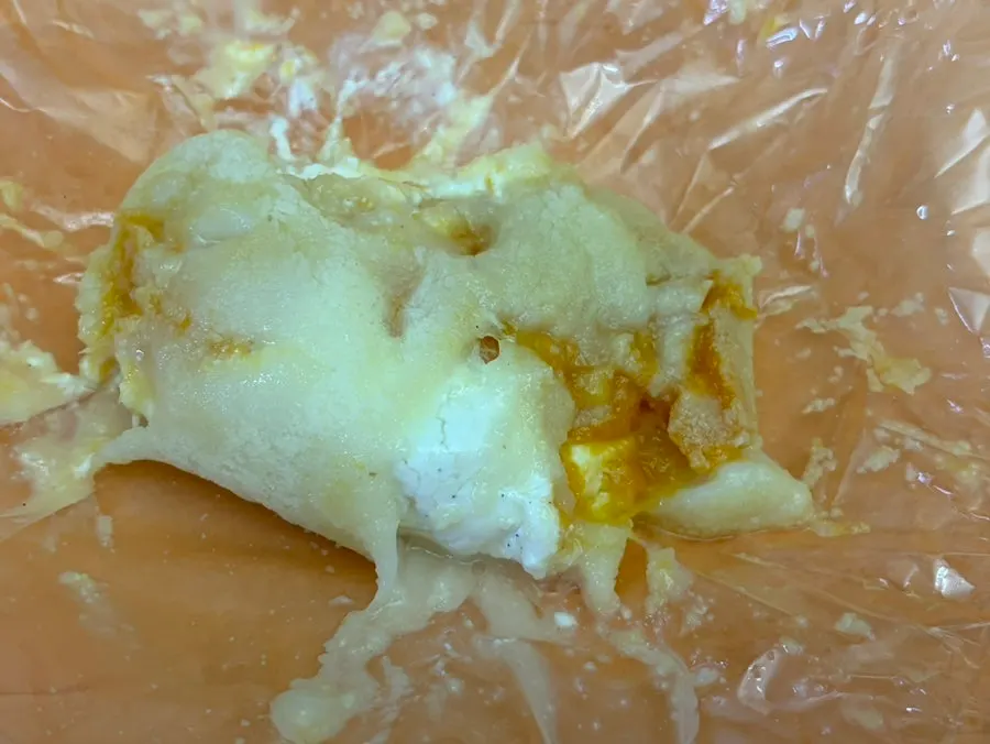 Cross-section of a giant fruit mochi with peach inside