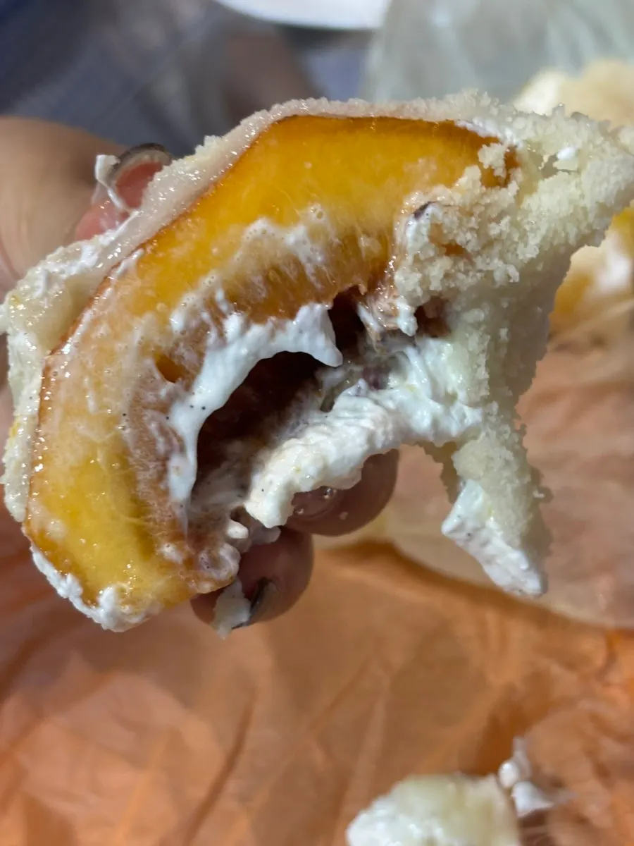 Cross-section of mango yogurt mochi showing the yogurt cream