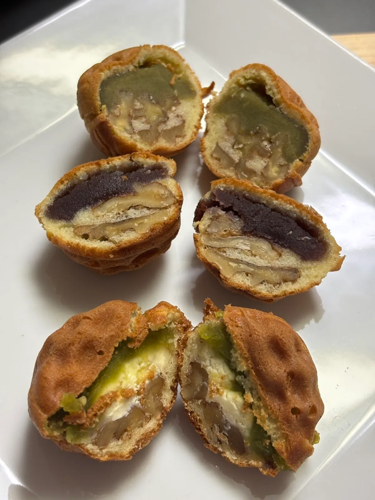 Close-up of a walnut pastry cross-section with whole walnut