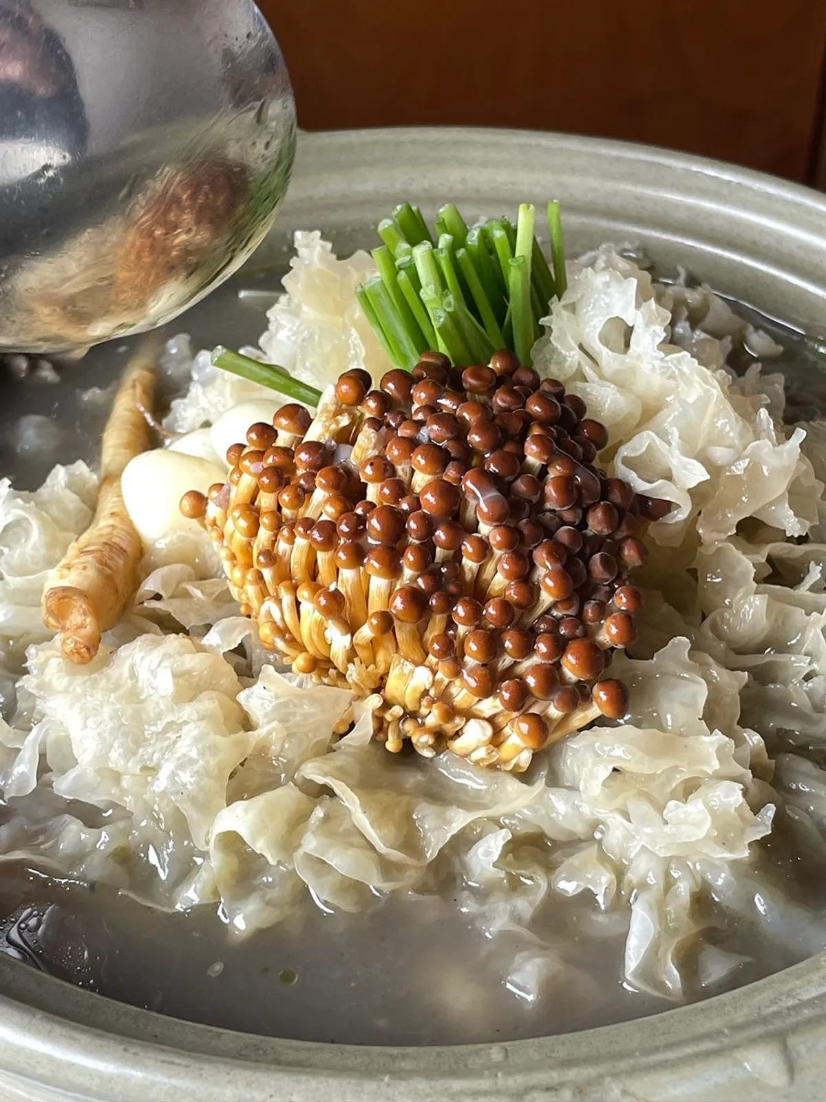 A full spread of eunyi mushroom black rice-crust chicken stew