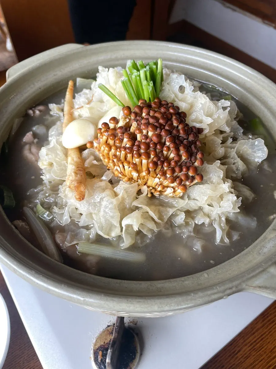 Close-up of the chicken stew ingredients starting to boil