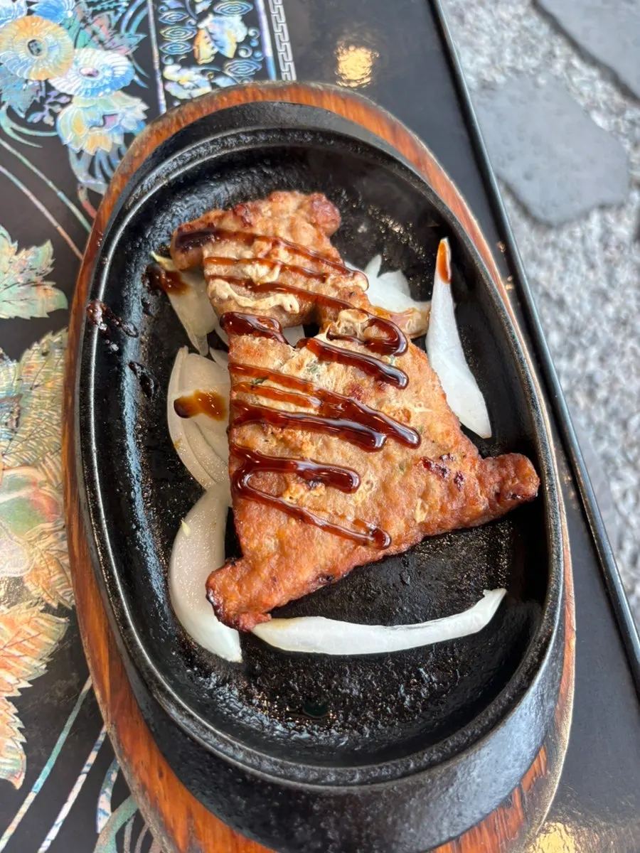 Cheomseongdae tteokgalbi on a hot stone plate