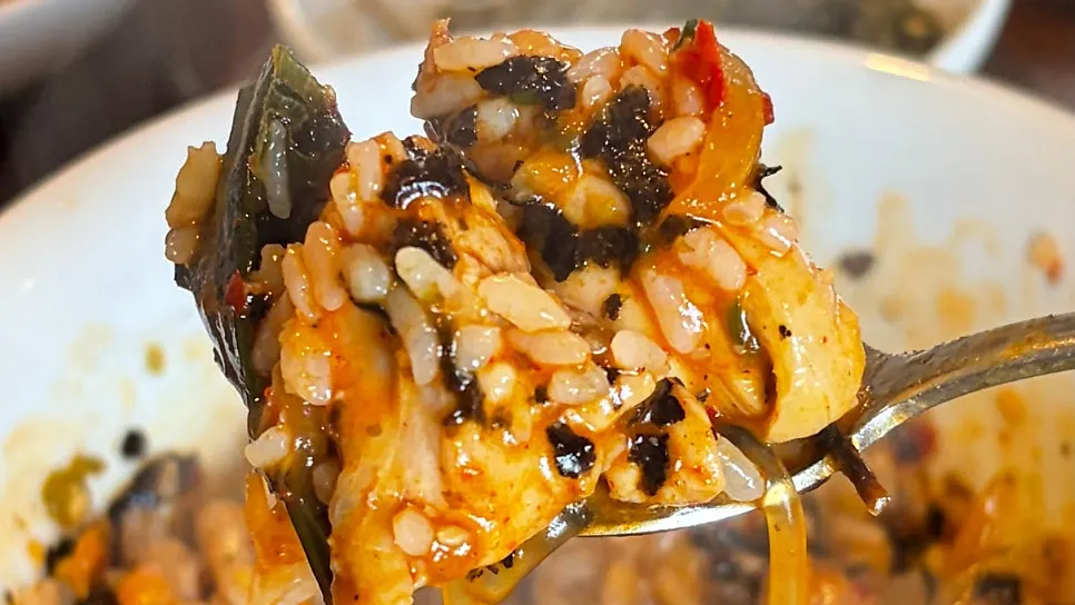 Large bowl of rice topped with seaweed flakes