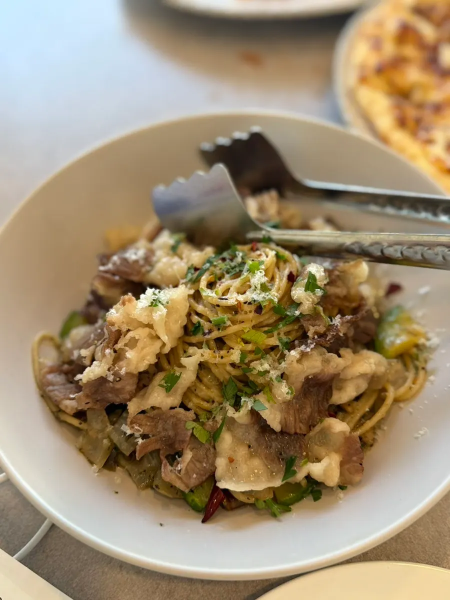 Beef brisket oil pasta served with pizza