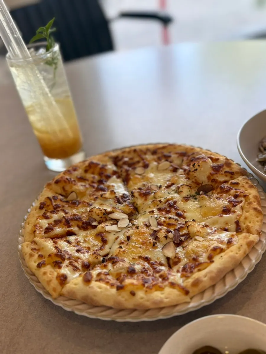 Photo introducing quattro cheese pizza