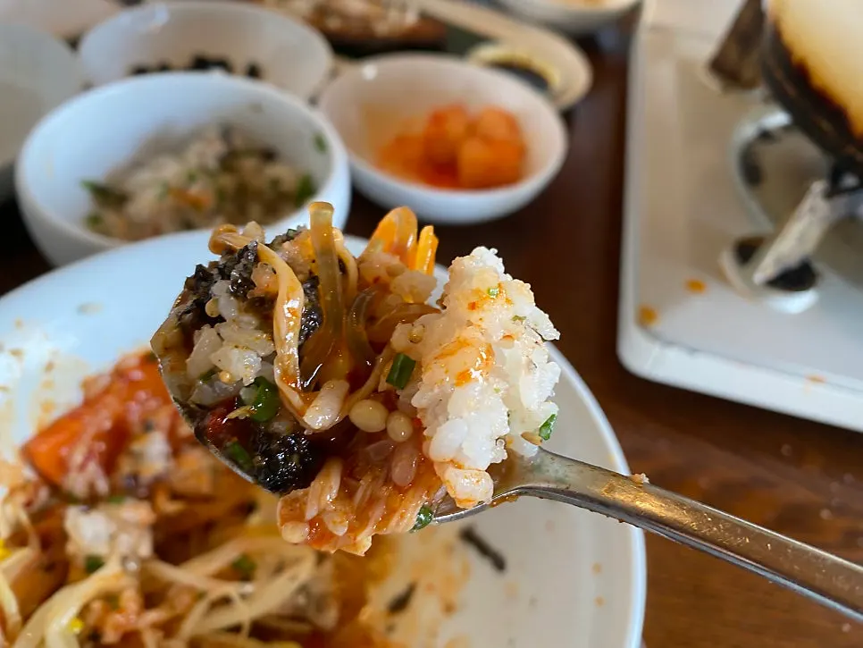 Full meal scene with dakbokkeumtang, rice, and side dishes
