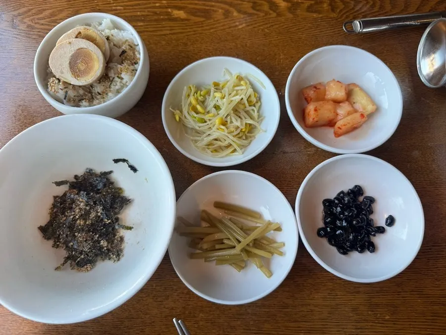 Table setting with ordered egg rice and side dishes