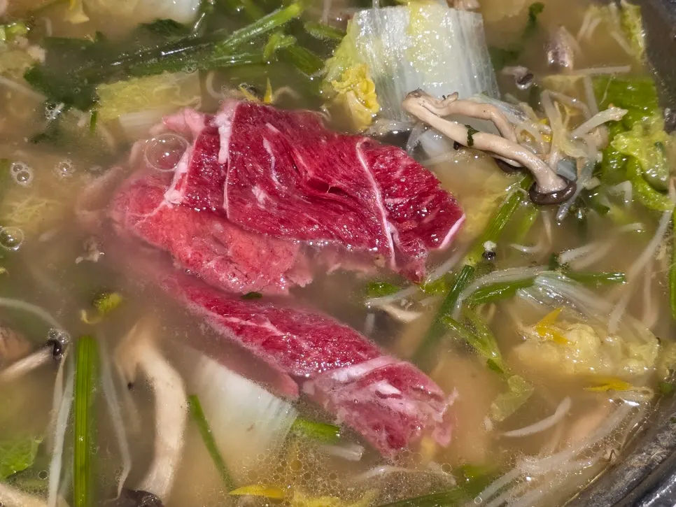 Mild spice-level hot pot with added spicy sauce