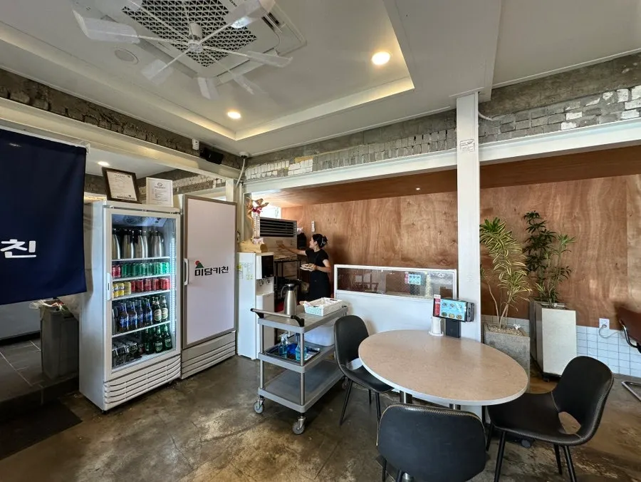 Interior with tables arranged along passageways