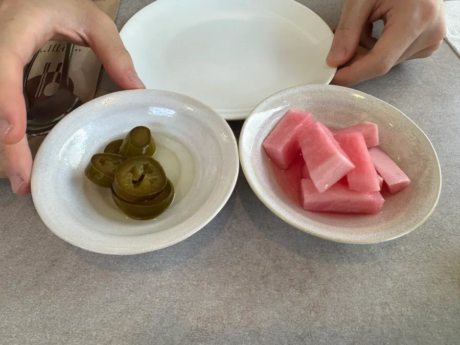 Basic sides of pickled radish and jalapeños