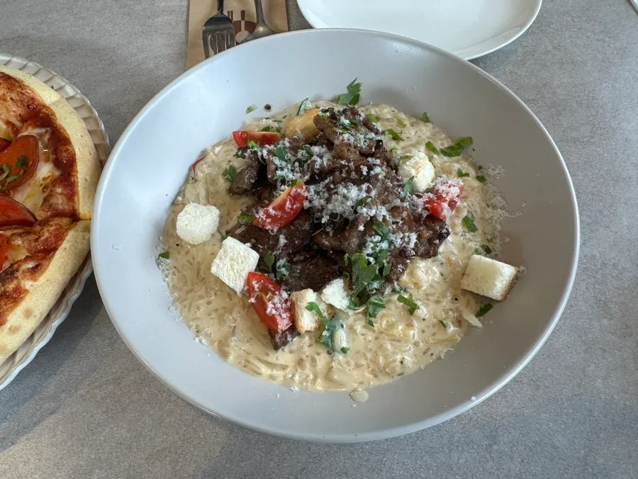 Beef risotto topped with meat
