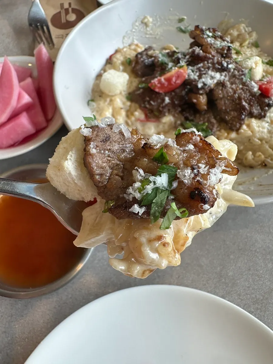 A bite of risotto and meat together
