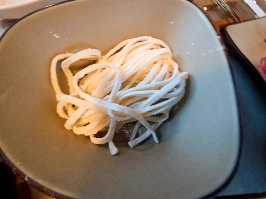 Shabu-shabu beef being blanched in the broth