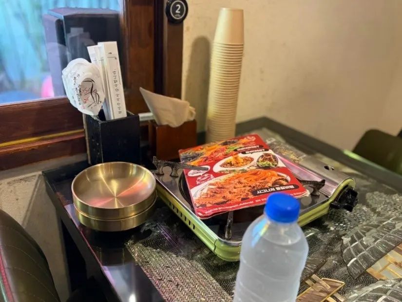 Menu and dining space at Hwangnam Dukkebi Restaurant