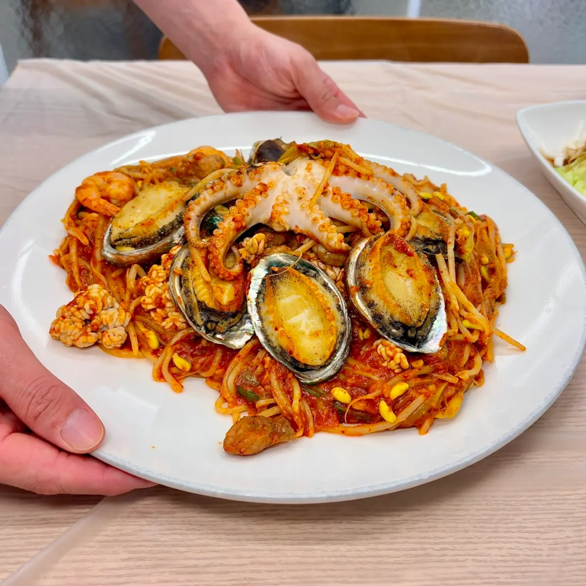 Featured photo of abalone seafood stew at Wando Cham Jeonbokjip's Seonggeon-dong main branch in Gyeongju