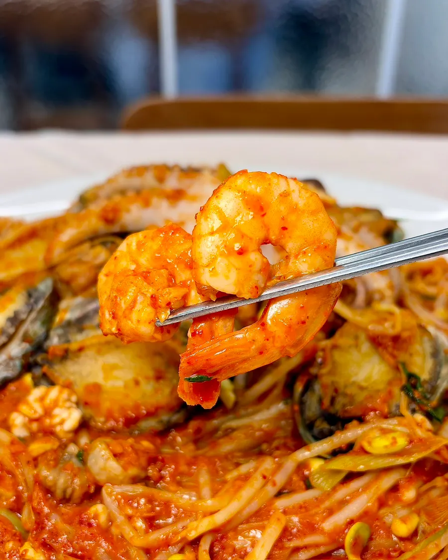 A large shrimp from the seafood stew