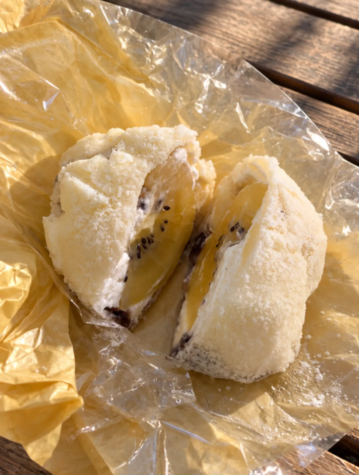 A cross-section of Tareudang's fruit mochi held in hand