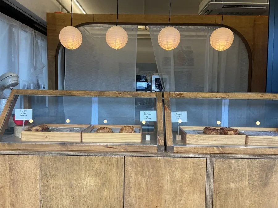Display case with chocolate, red bean, and apple pies