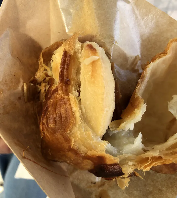 A bite taken out of the crisp apple pie pastry