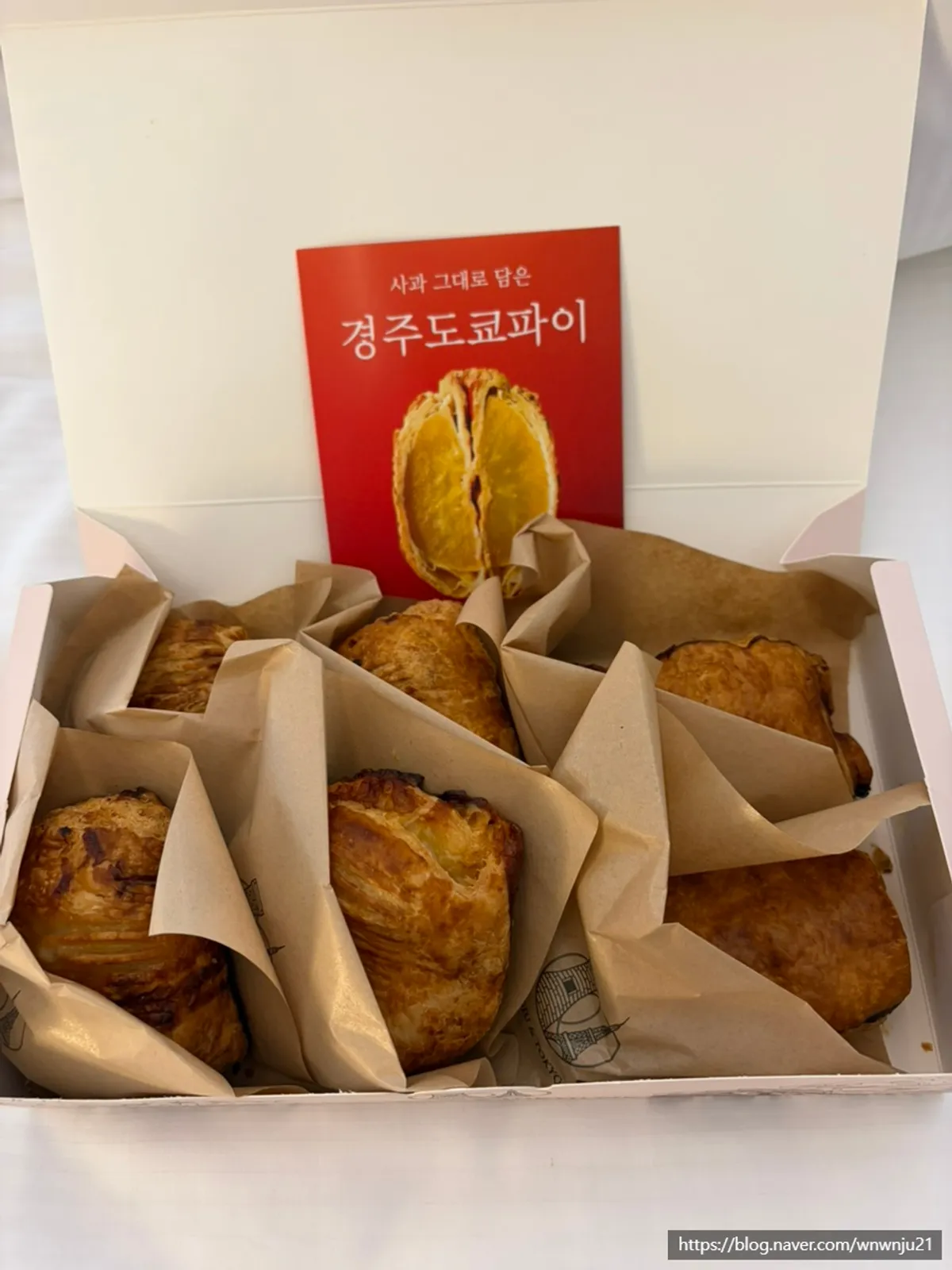 Inside the premium box with six pies