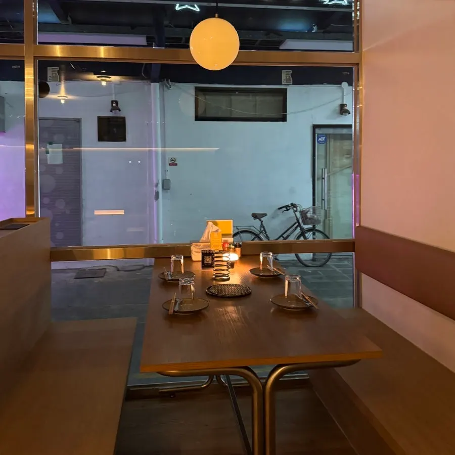 Interior of the izakaya with window tables for two