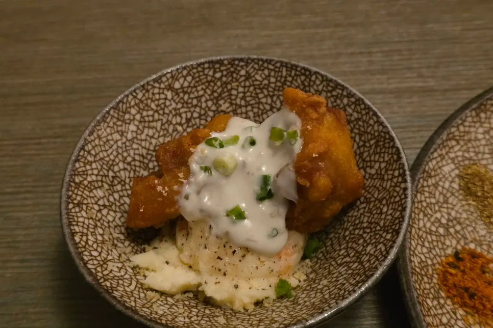 Chicken karaage served over potato salad