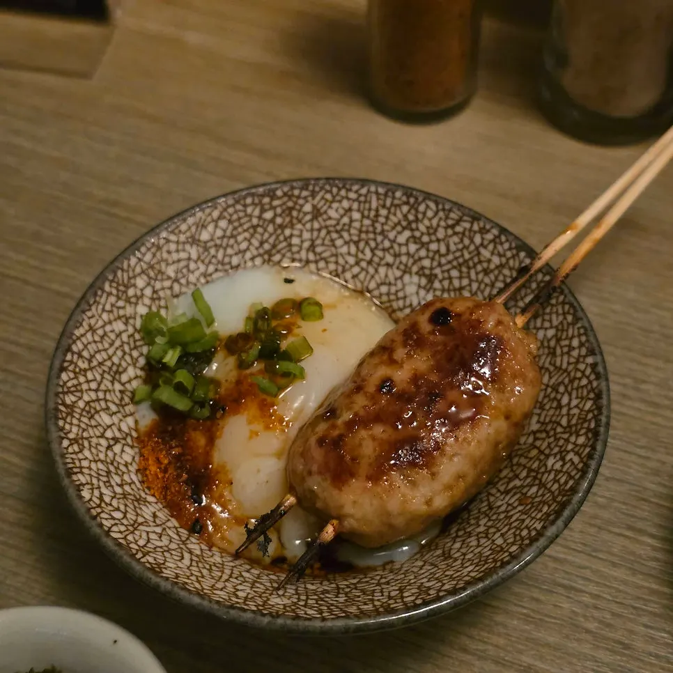 Tsukune served with a poached egg