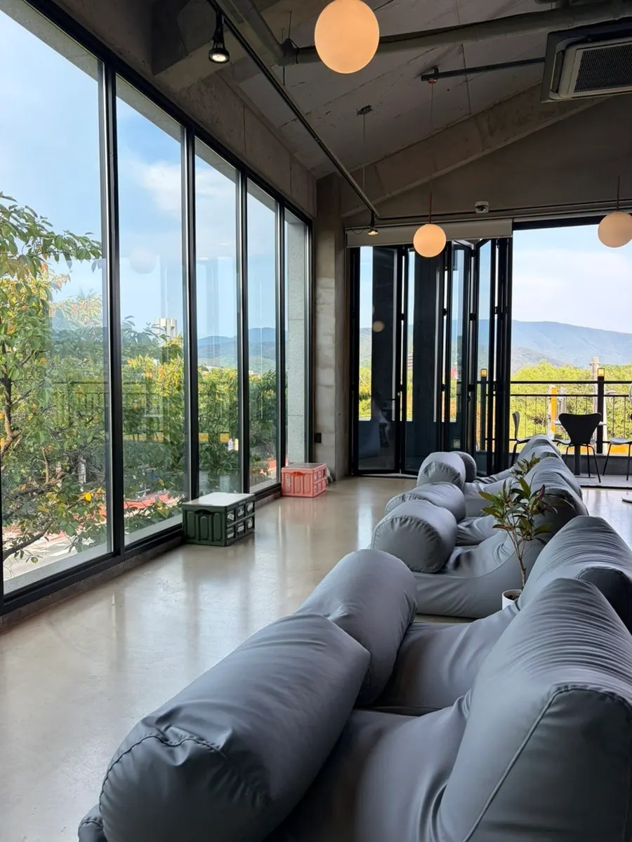 Comfortable second-floor seating at Yard where you can stretch your legs