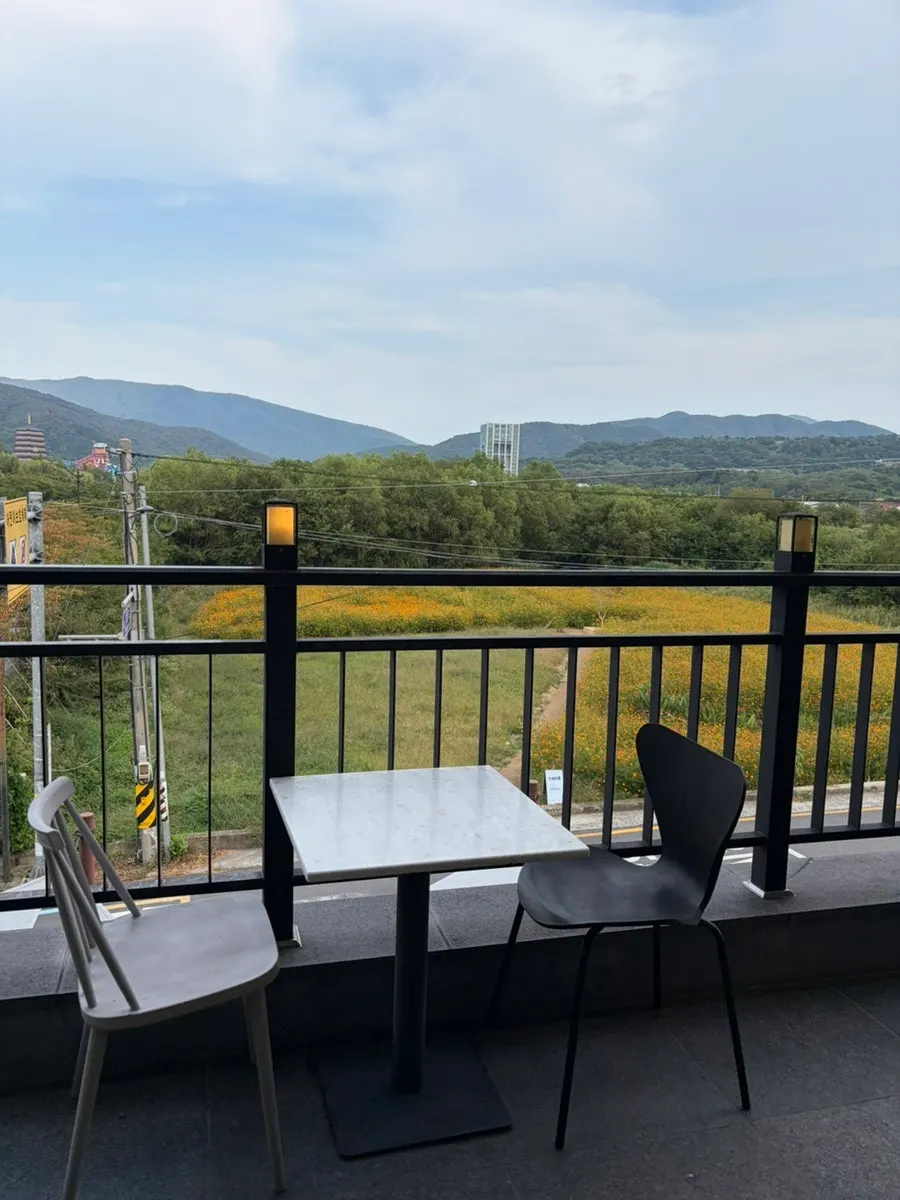 Second-floor terrace at Yard overlooking the flower field