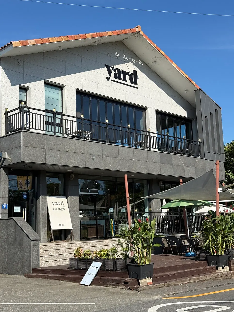 Exterior of Yard café with the flower field in front