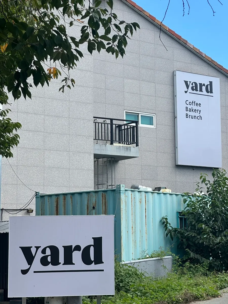 Umbrella photo zone and 2nd floor bean bags at Yard, a brunch café near Gyeongju World
