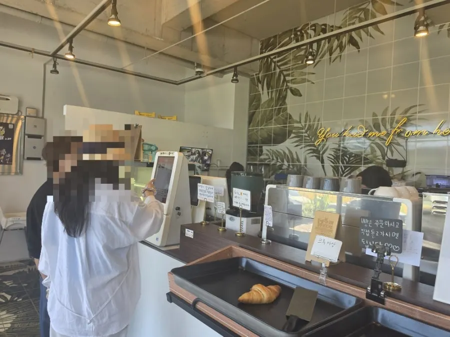 Kiosk ordering area in front of the counter