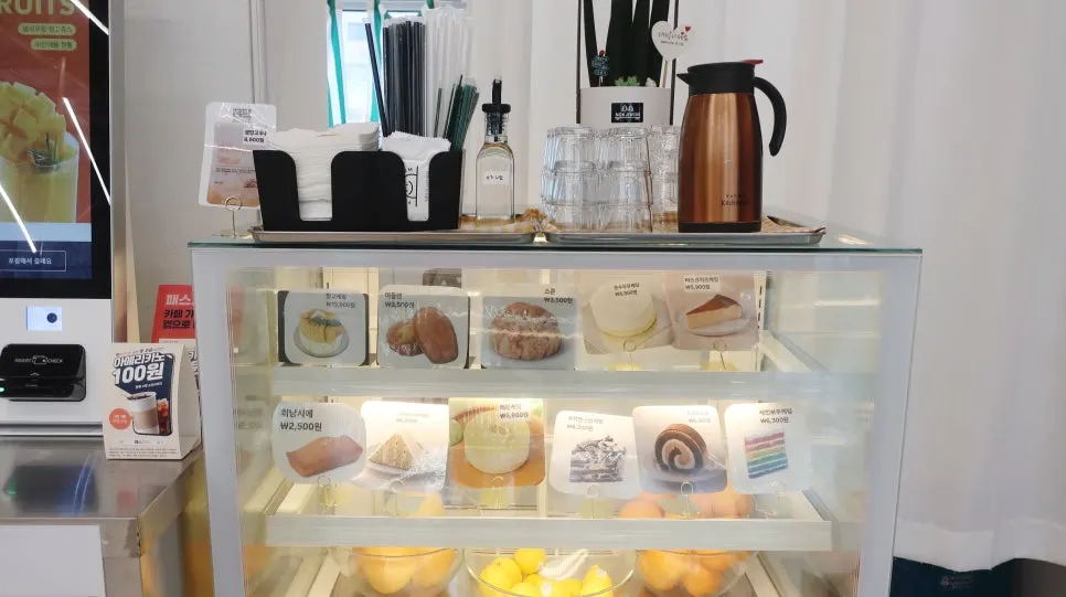 Display case of cakes and madeleines