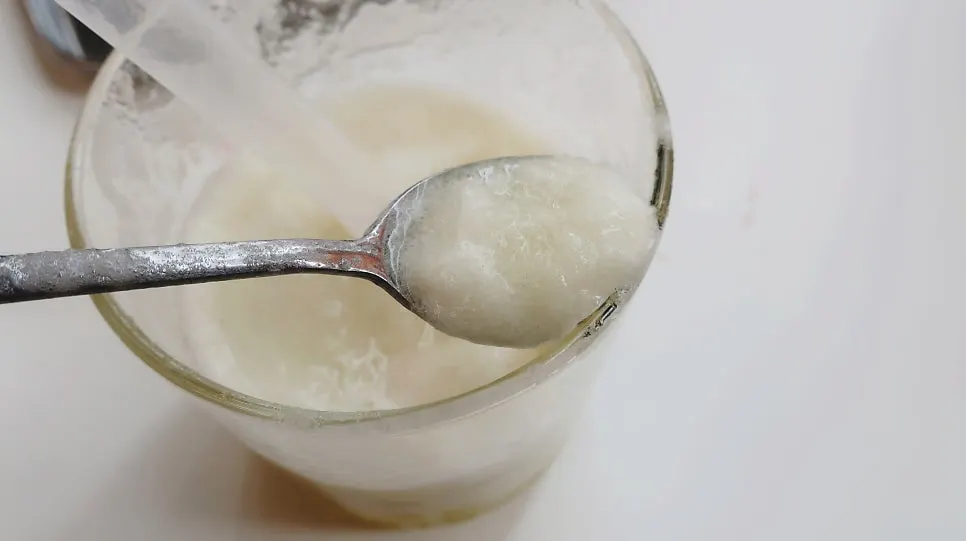 Eating smoothie with a spoon