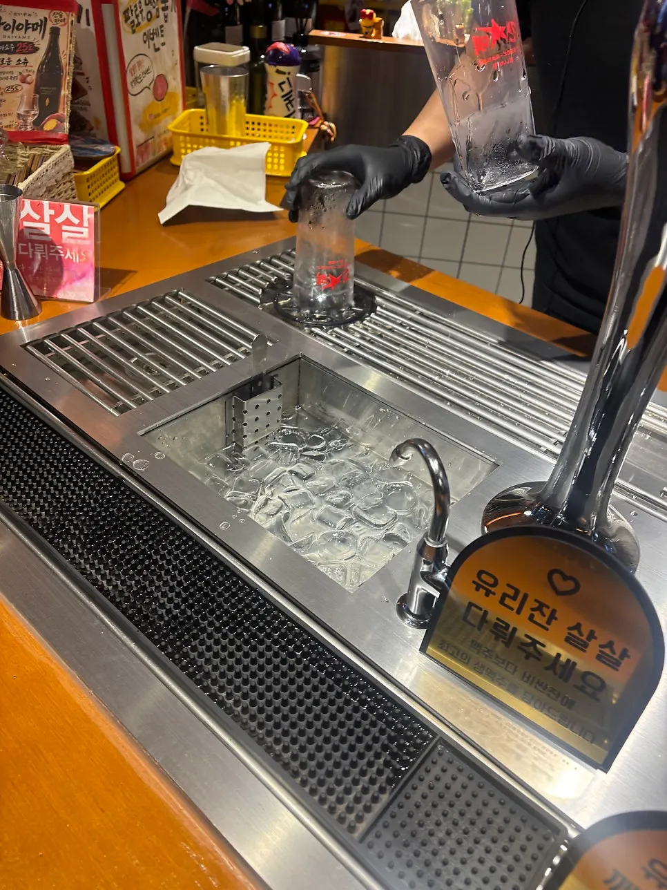 Standing table seating while staff explains the beer