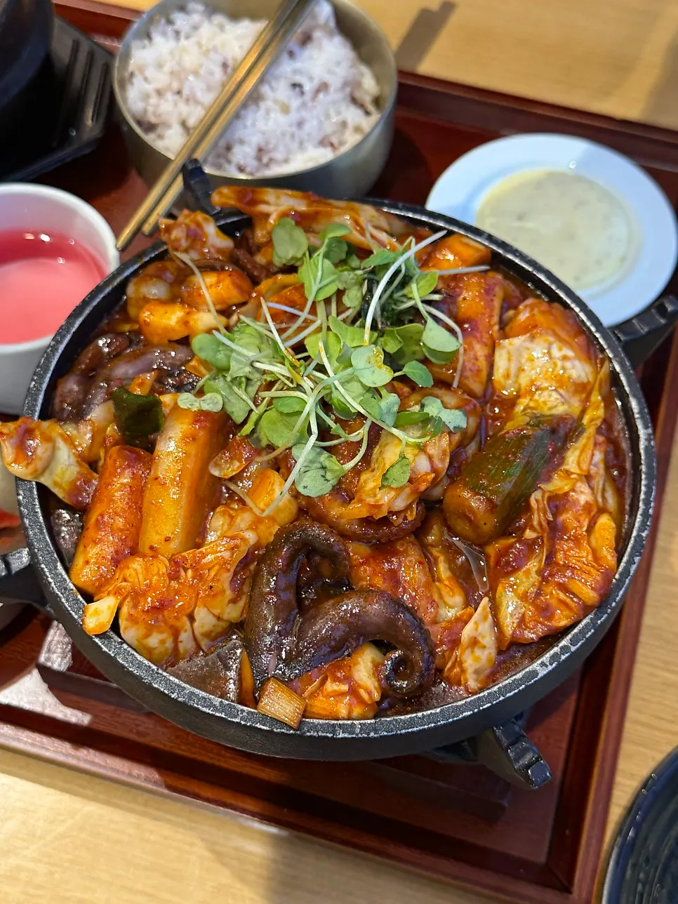 Stir-fried baby octopus served in an individual brazier