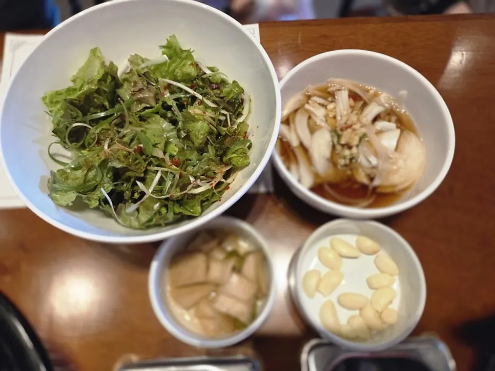 Table setting with onion soy sauce and pickled onions