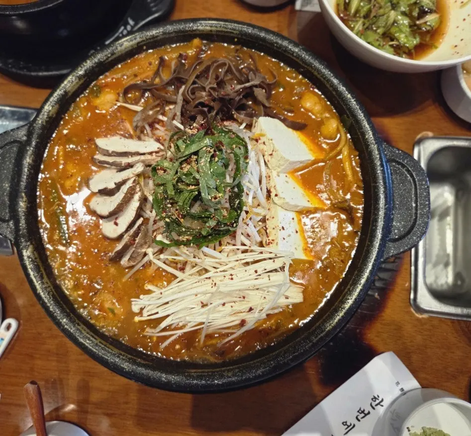 A bite of meat paired with grilled kimchi