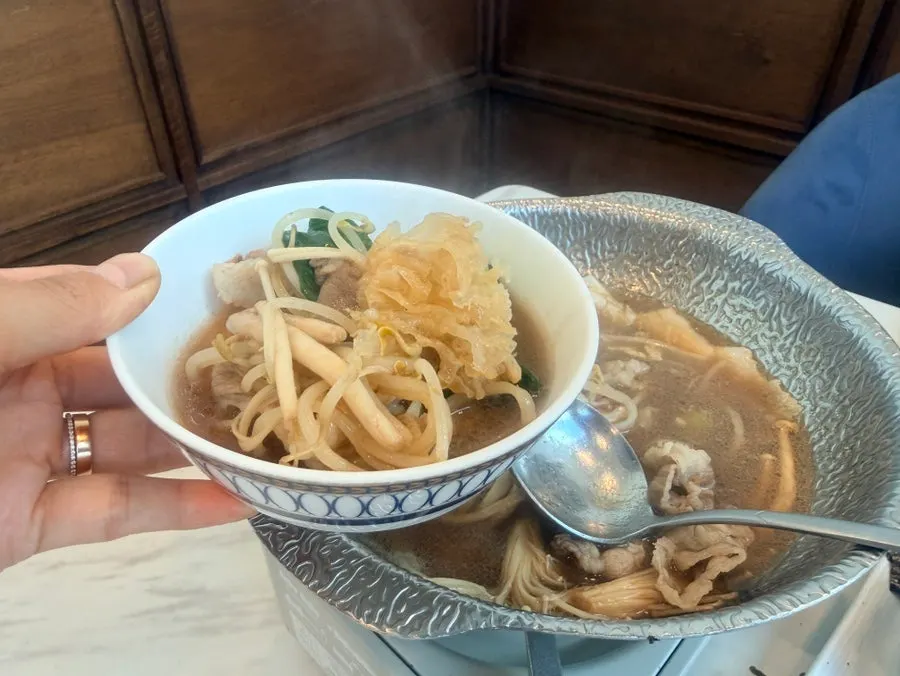 Side dishes served alongside the hot pot