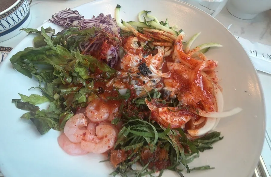 Crunchy abalone pieces on top of the mulhoe