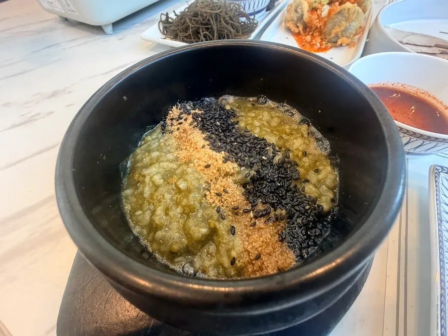 Warm mini abalone porridge served with the summer set