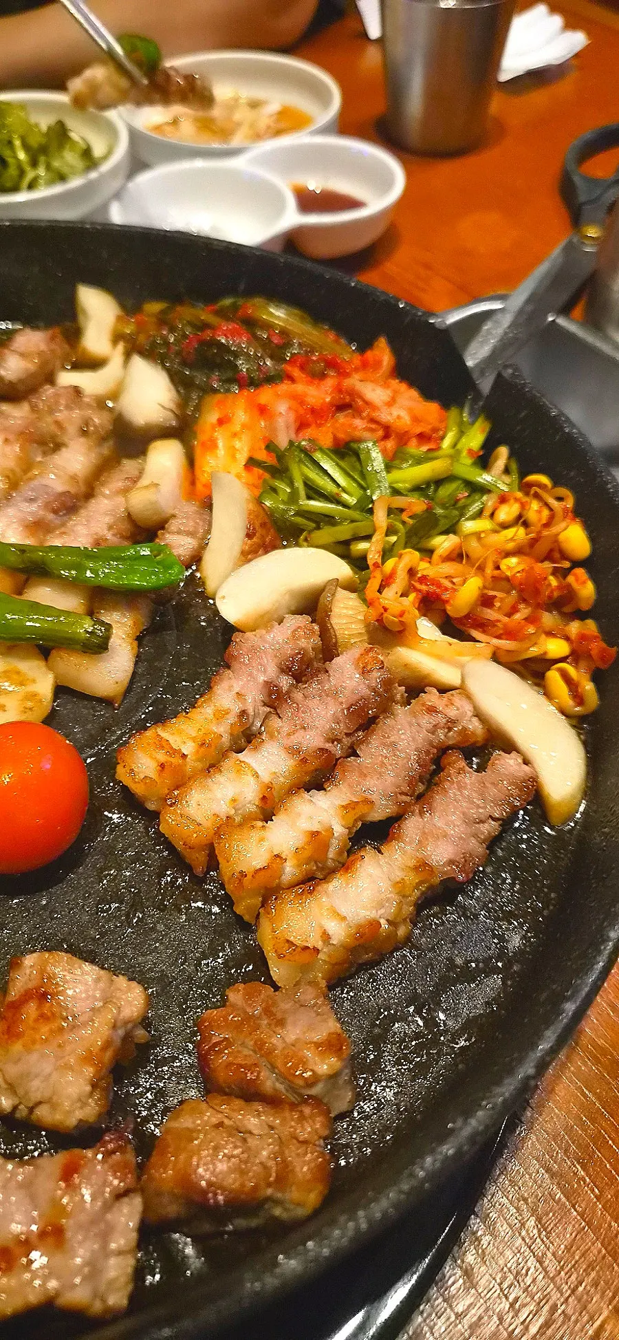 Vegetable side dishes grilled together in the meat fat