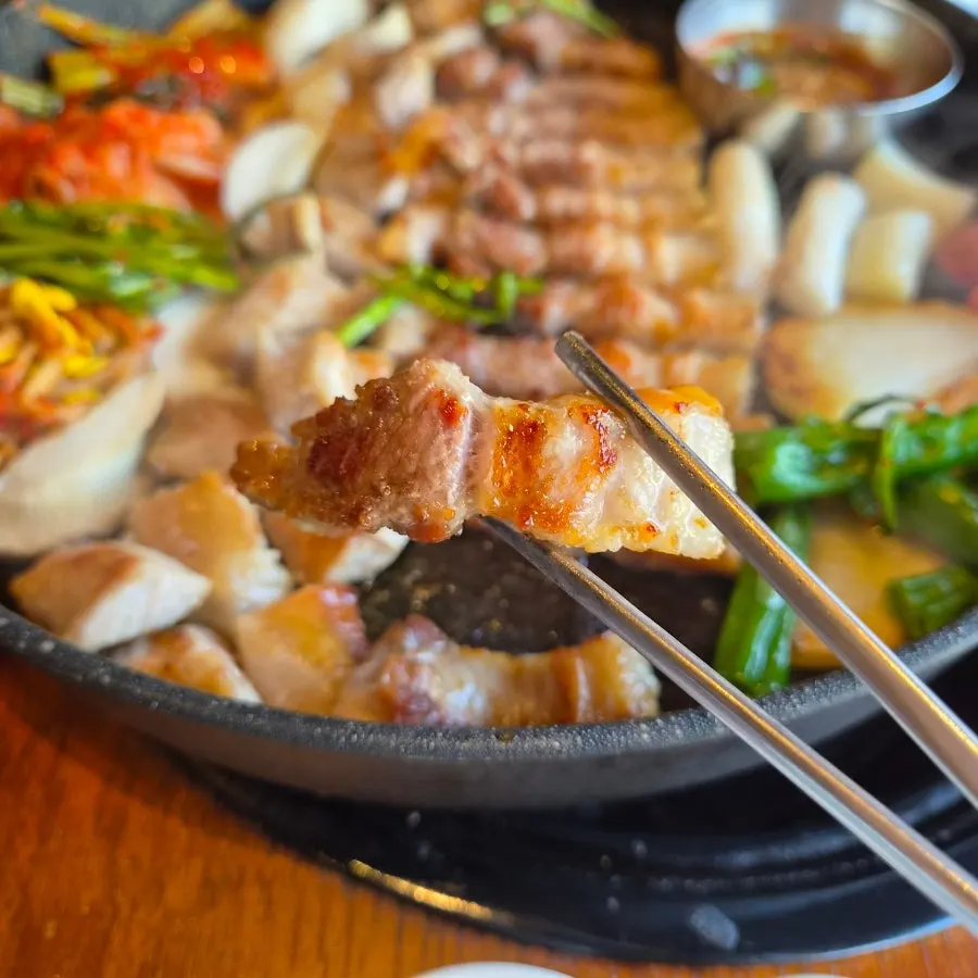 A thick piece of grilled high-fat pork belly