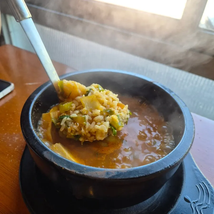 A spoonful of rice grains from the doenjang sulbap