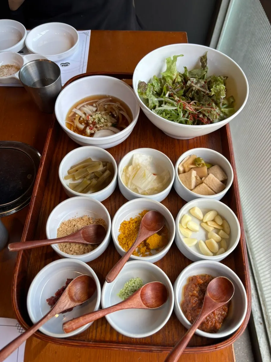 9-side sauce spread with wooden spoons
