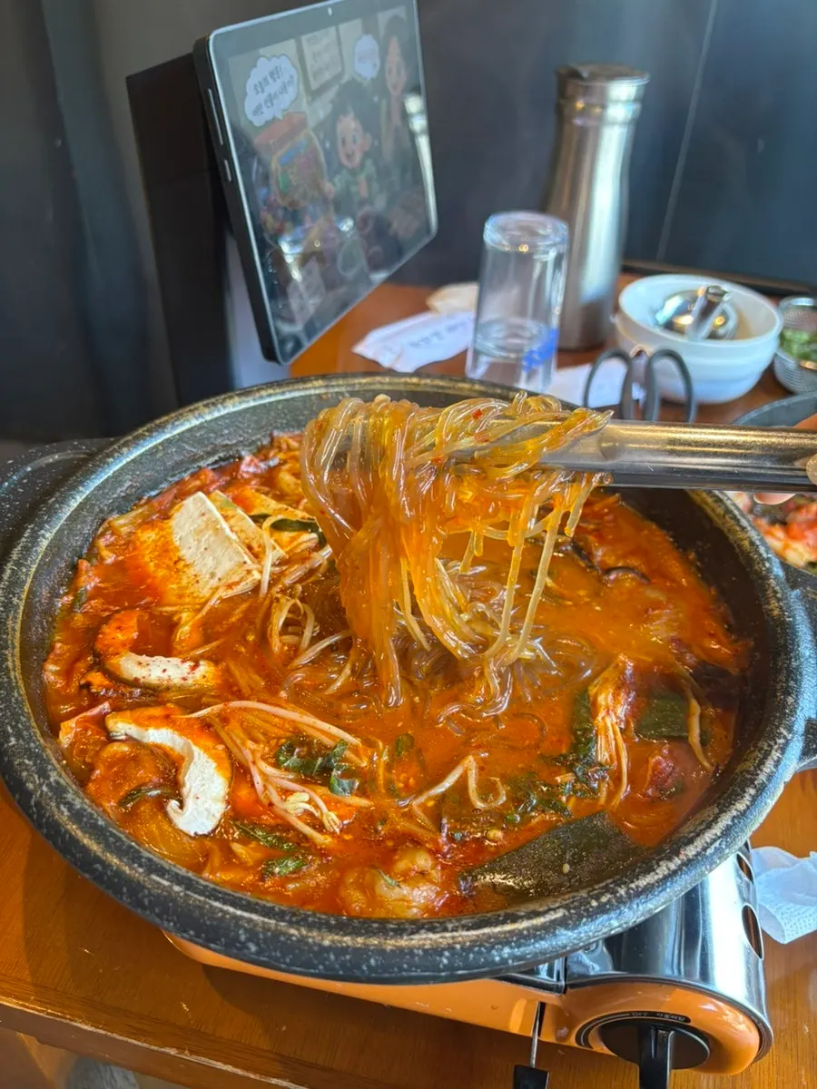 Glass noodles pulled from the daechang hot pot broth