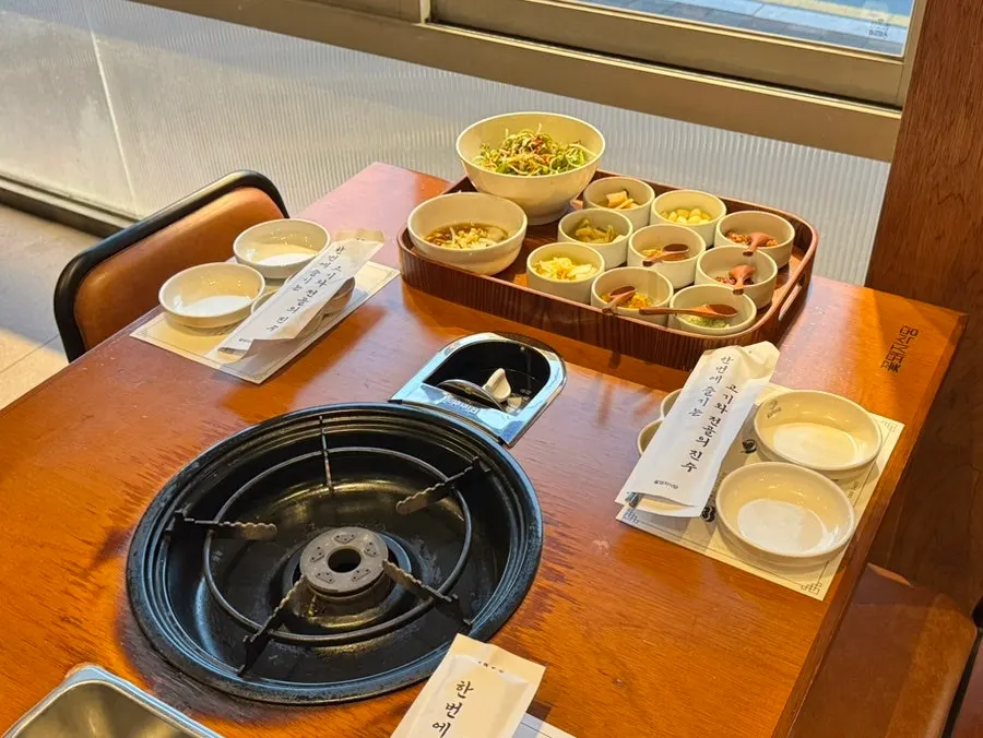 Neat tray of side dishes served at the table