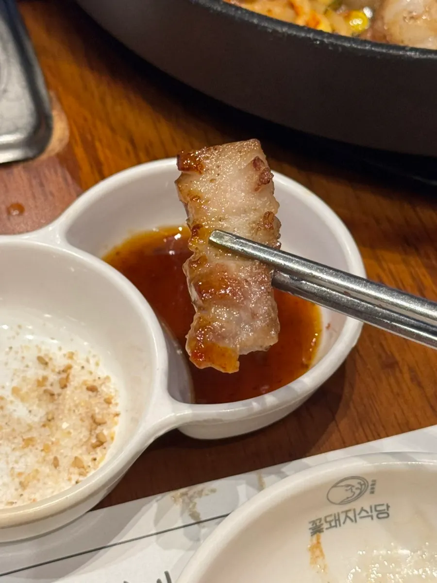 Grilled garnish of onion, potato, and shishito-style pepper