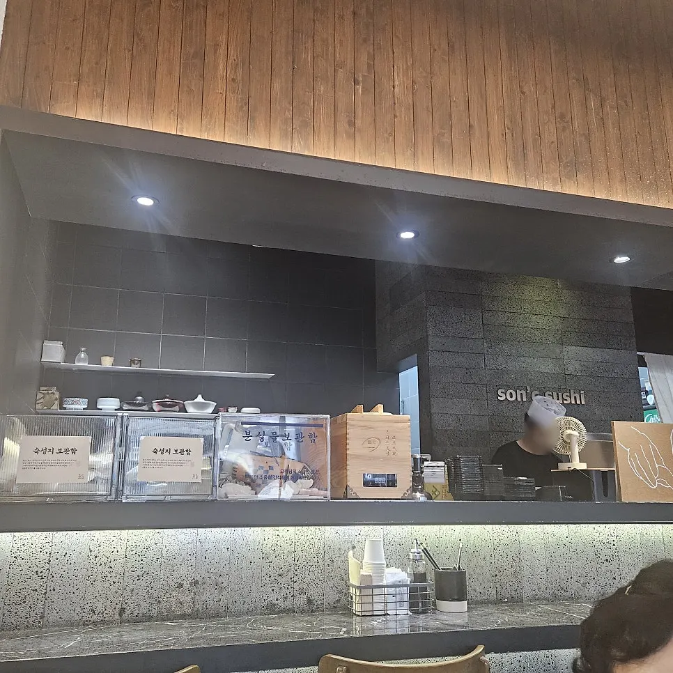 Seating with newly installed partitions at Sonsi Sushi